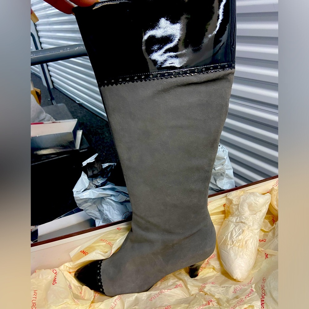 Gorgeous gray suede calf length boot with patent leather trim. Size 8.